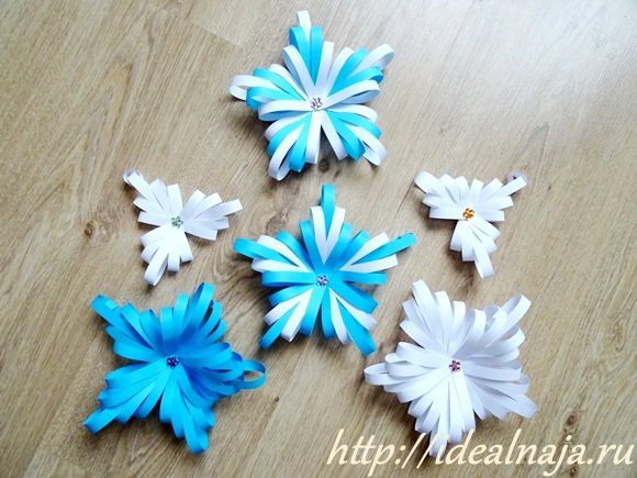 Варианты снежинок из бумажных полос